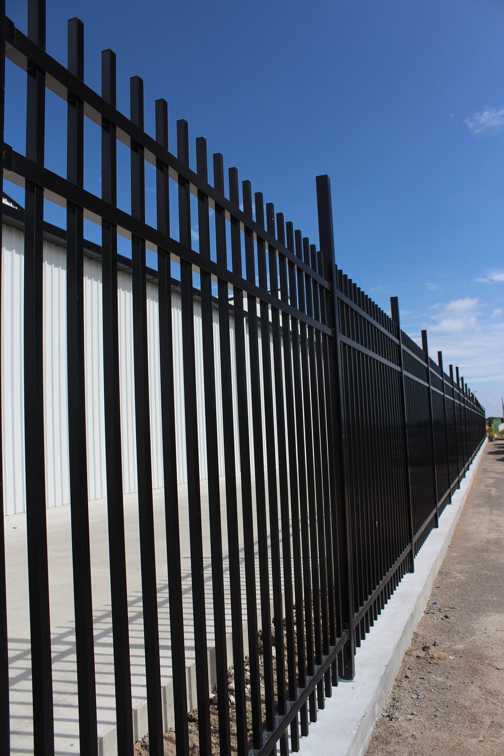 Aluminium Secura Panel fencing WCS install with mowing strip