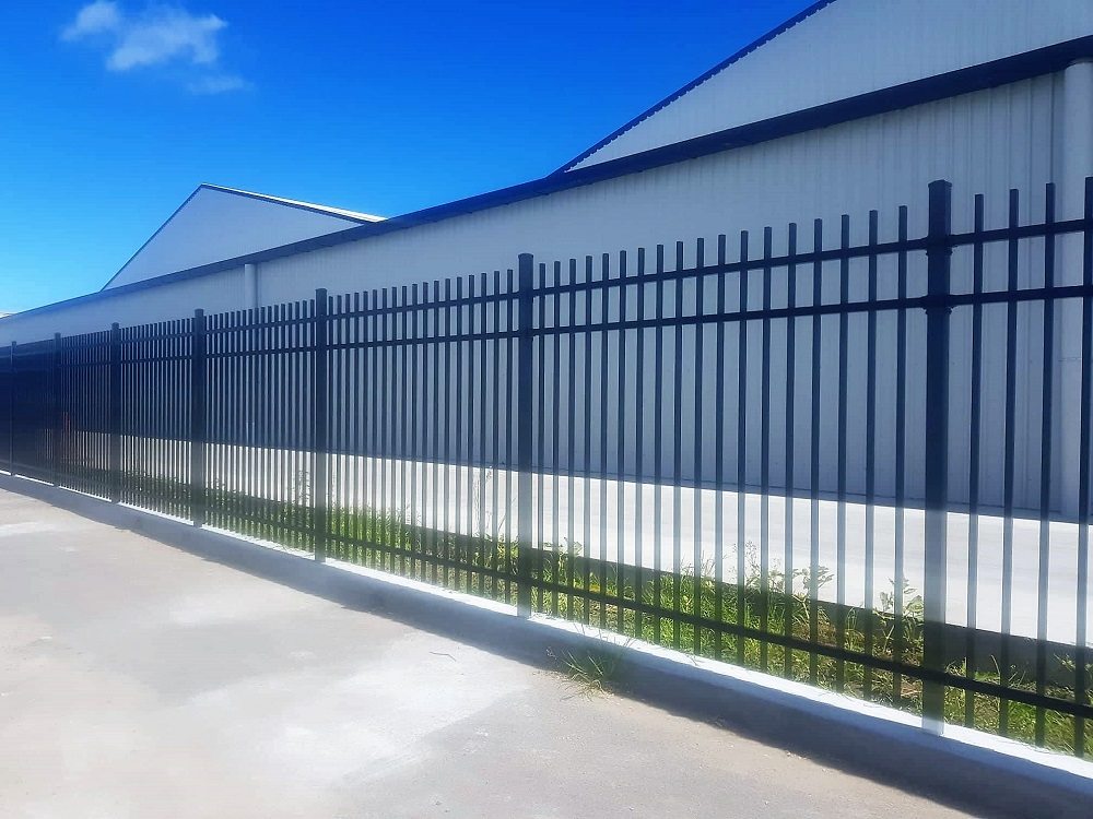 Security fence with mowing strip
